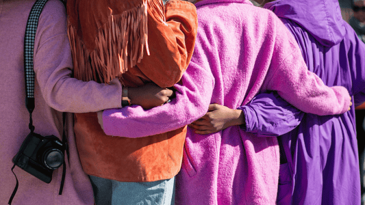 Group of four people embracing